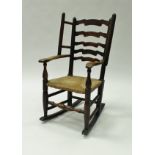 A 19th Century Dales ash ladder back rush seated wingback chair on turned legs and rockers 90 cm