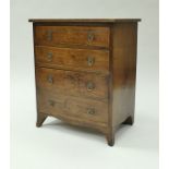 An early 19th Century oak chest with cross-banded top,