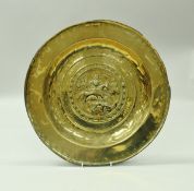 A 17th Century Nuremberg brass alms dish,