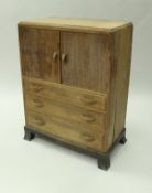 An oak chest of three short over one long drawer and an oak tallboy with two cupboard doors above