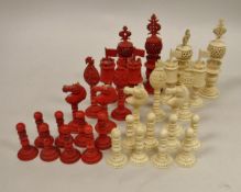 A circa 1900 Anglo-Chinese chess set in plain and red stained ivory,