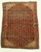 A fine Shenna rug, the central panel set with all over stylised floral decoration on a blue ground,