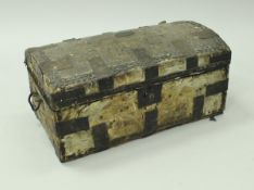 A 19th Century dome top trunk hide covered and iron bound,