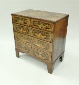 An 18th Century walnut and inlaid chest of drawers in the Dutch manner,