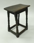 A 17th Century and later oak joint stool on slender turned and ringed legs,