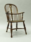 A 19th Century Thames Valley beech and elm stick back elbow chair on turned and ringed supports