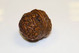 A 19th Century Oriental carved walnut with figural decoration,