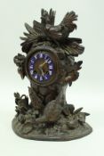 A 19th Century Black Forest type mantle clock, with cockerel and hens and leaf decoration,