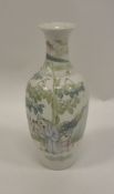 A Chinese Republic porcelain vase decorated with sage and boys in a garden setting with calligraphy