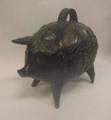 A 20th Century black and bronze glazed pottery pig money box of large proportions with high relief
