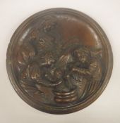 A 19th Century carved oak plaque depicting Classically robed woman watching two servants bathing a