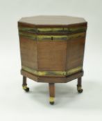 A George III mahogany and brass bound wine cooler of octagonal form,