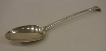 An 18th Century silver basting spoon, "Onslow" pattern,