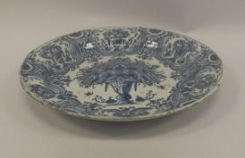 An 18th Century English Delft blue and white charger,