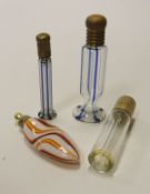 A collection of three Nailsea type glass scent bottles,