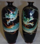 A pair of Meiji period Japanese cloisonné vases dark blue ground decorated with three-toed dragons,