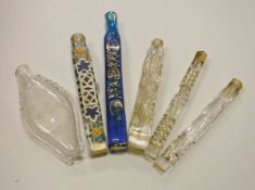 A collection of five cut glass gilded and or painted glass scent vials,