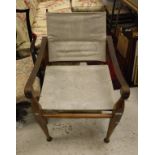 A teak leather and canvas campaign style chair