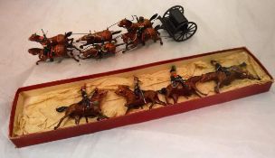 A Britains six horse carriage with limber together with a collection of four mounted cavalry