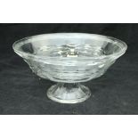 A Daum of Nancy clear glass bowl with ribbed decoration raised on a circular folded foot signed to