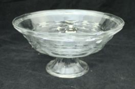 A Daum of Nancy clear glass bowl with ribbed decoration raised on a circular folded foot signed to