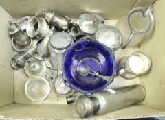 A box containing various small silverwares including two pairs of baluster peppers,