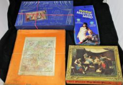 A box of various puzzles to include a Victory "Geographical puzzle of England",