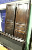 A 19th Century French oak armoire of large proportions the cornice with floral carved decoration
