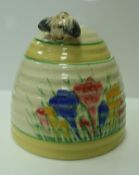 A Clarice Cliff "Bizarre" "Spring Crocus" honey pot and cover CONDITION REPORTS Some