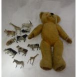 A small gold plush bear and a small quantity of painted lead animals ,