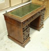 A Victorian mahogany kneehole desk of small proportions