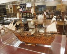 A wooden model of "HMS Victory 1805" in perspex case