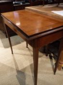 An Edwardian mahogany and satinwood banded fold-over card table in the Sheraton Revival taste