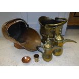 A collection of various metal wares to include copper coal helmet, brass coal helmet,