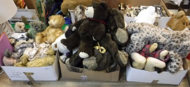 A box containing a collection of various Teddy Bear Orphanage bears together with various blankets