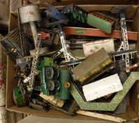 A large box of various 0 gauge clockwork tin plate train wagons, locomotive accessories, etc,