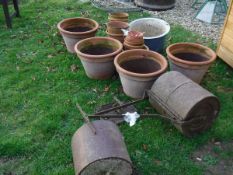 A collection of terracotta plant pots,