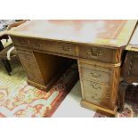 A 20th Century mahogany kneehole desk in the Georgian style