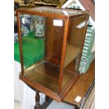 A mahogany framed and glazed four sided shop display cabinet,