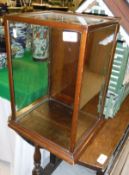A mahogany framed and glazed four sided shop display cabinet,