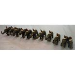 A collection of eleven circa 1930 painted lead figures of elephants and mahout stamped "made in