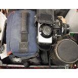 A box of various cameras and a Vivatar Series I lens