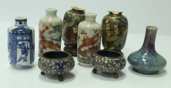 A pair of Japanese porcelain dragon decorated scent bottles, a pair of Satsuma ware miniature vases,