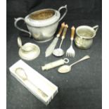 A small silver capstan inkwell, plated christening mug, plated sugar basin and spoon,