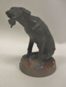 AFTER FOUQUES "Chien de chasse" bronze patinated spelter study of a seated dog on a rosso marble