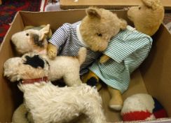 A box of various early to mid 20th Century soft toys including a wood wool filled gold plush bear