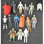 A plastic bucket containing various plastic Star Wars figures and two A Team figures of Mr T and