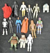 A plastic bucket containing various plastic Star Wars figures and two A Team figures of Mr T and