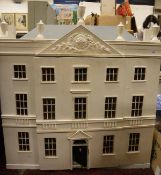 A painted wooden dolls house,