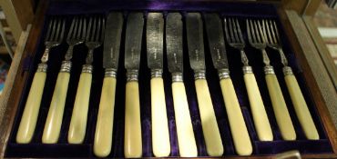 A set of nine Victorian silver bladed ivory handled fish knives and forks (by Harrison Brothers &